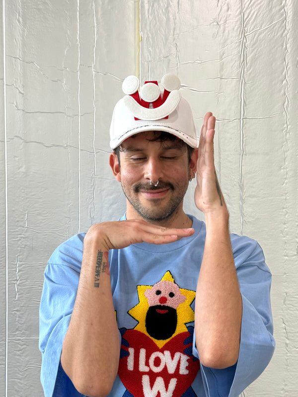 Smiley Cap in White by Walter van Beirendonck