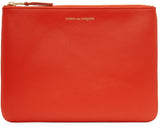 COMME DES GARÇONS CLASSIC POUCH orange