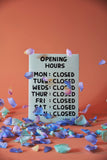 Opening Hours Tea Towel - Third Drawer Down X David Shrigley